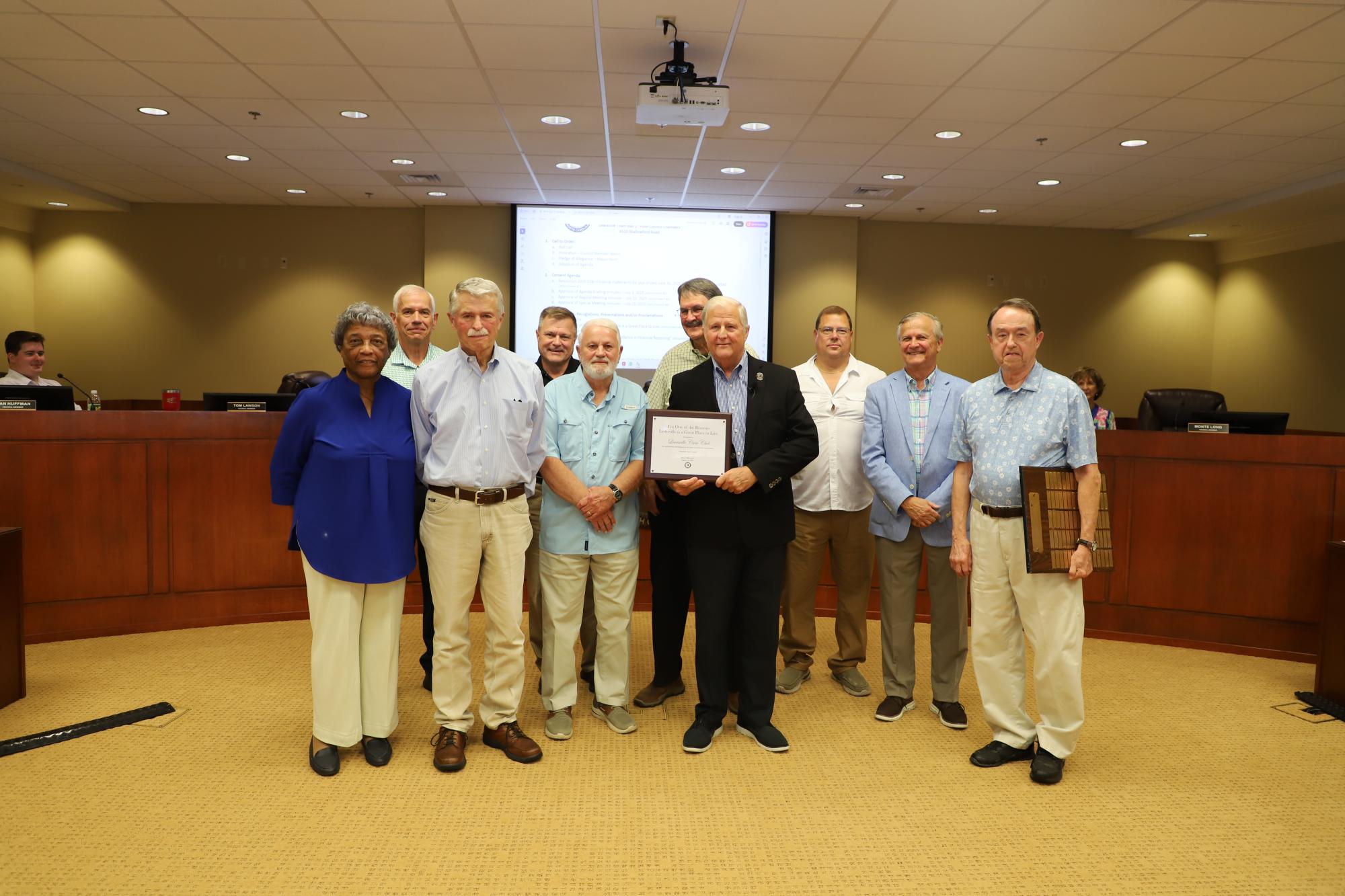 The Lewisville Civic Club accepts the I'm One of the Reasons Lewisville is a Great Place to Live award, presented by Mayor Mike Horn.